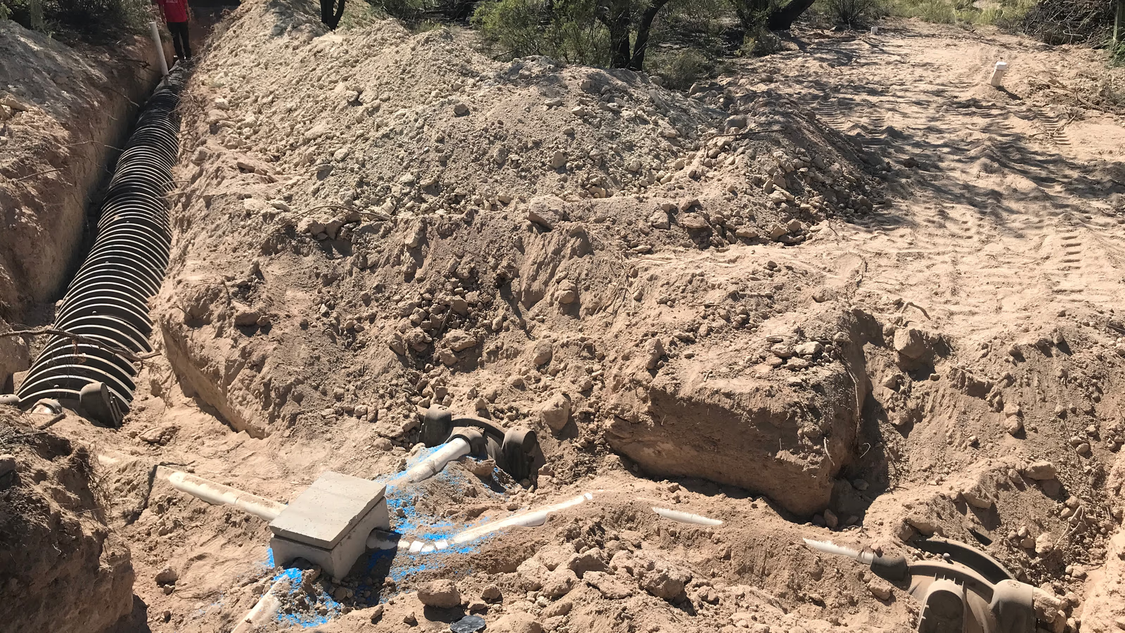 Drain field excavation and repair work in progress at a Miami-Dade County residential property