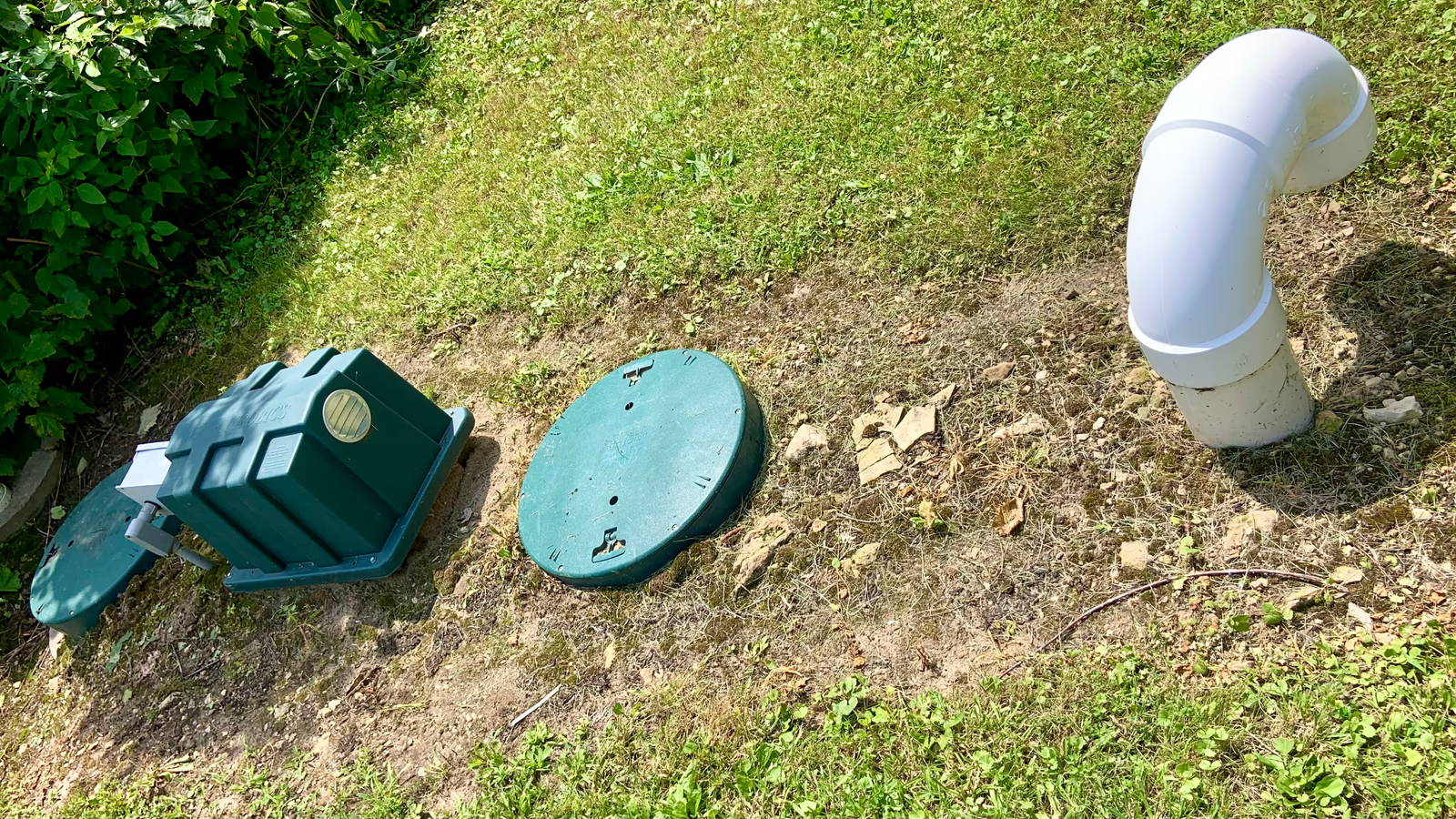 Vacuum truck performing septic tank pumping at a Miami-Dade residential property